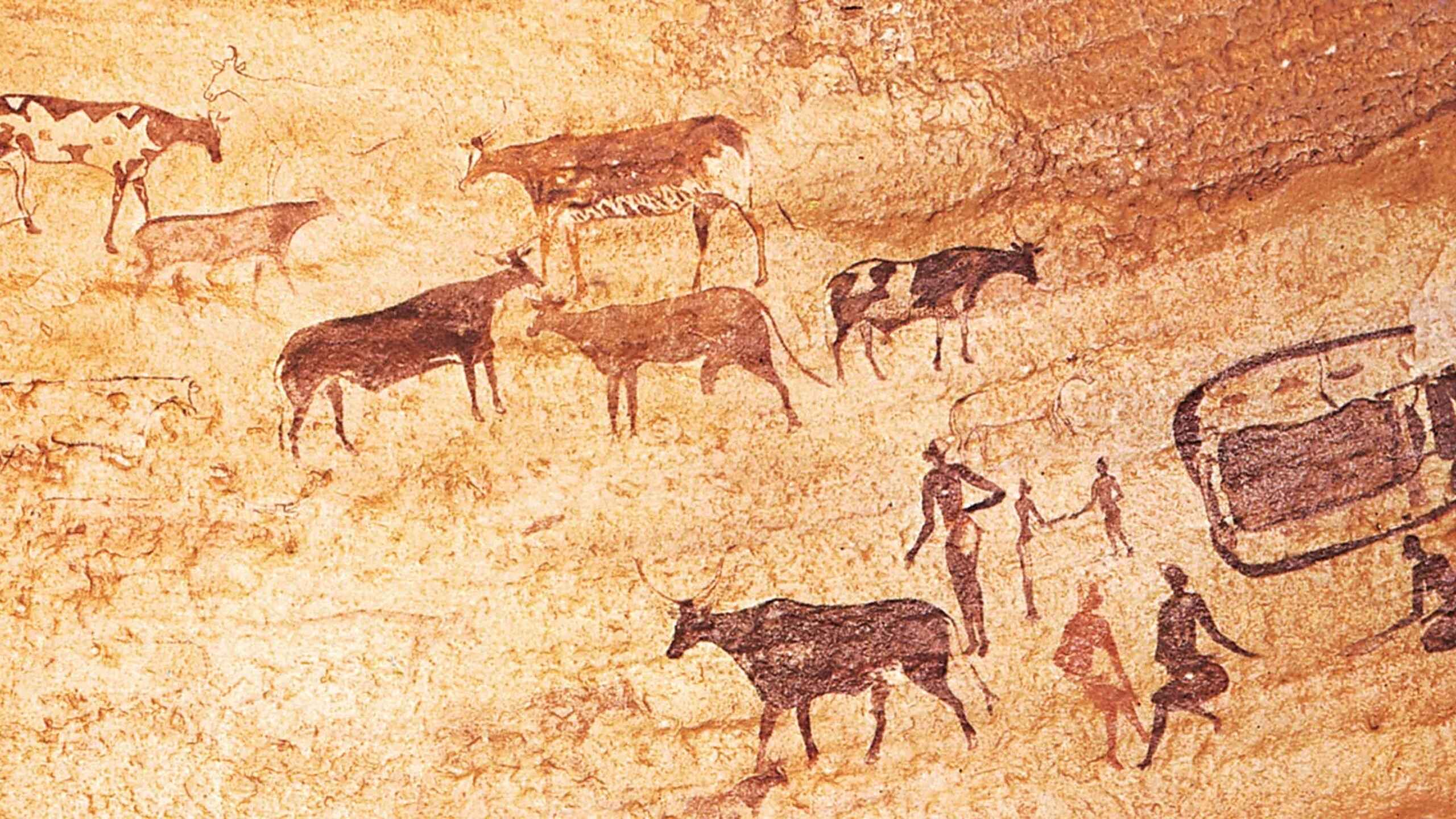 Ancient rock art depicting hunters, herds of animals, and human figures engaged in hunting and gathering activities