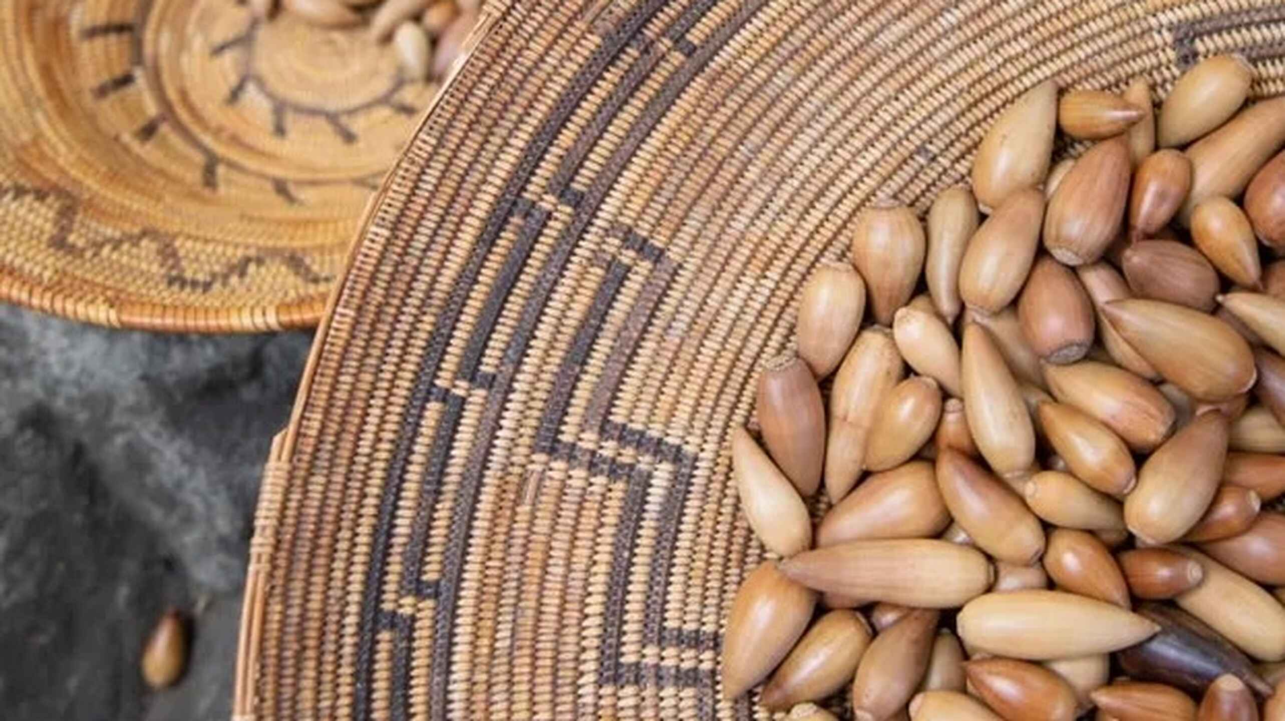 Peanuts in traditional woven baskets with decorative patterns