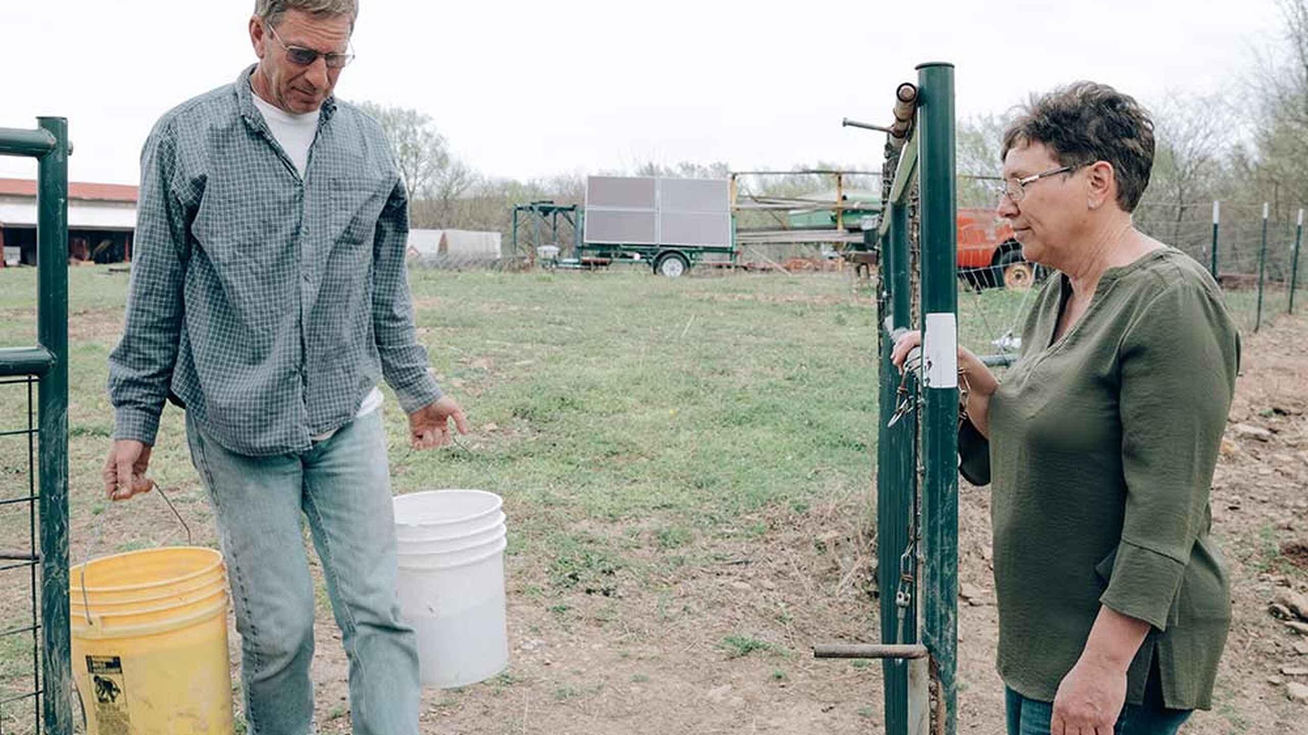 Gail Fuller discusses sustainable farming practices with a colleague at her farm