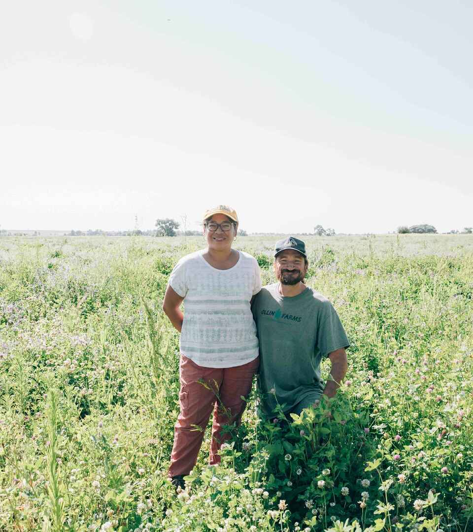 Two farmers stand in a diverse cover crop field in the Texas Panhandle