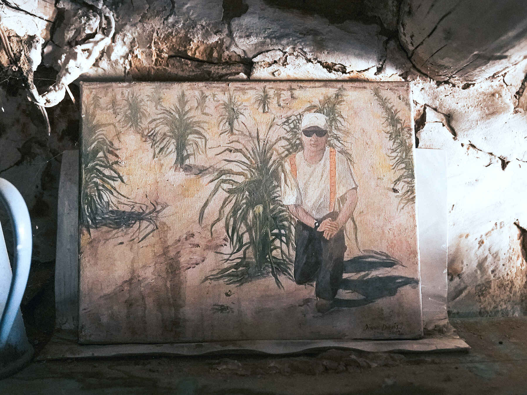 Mural painting of a Hopi farmer tending to corn plants in traditional agricultural practice