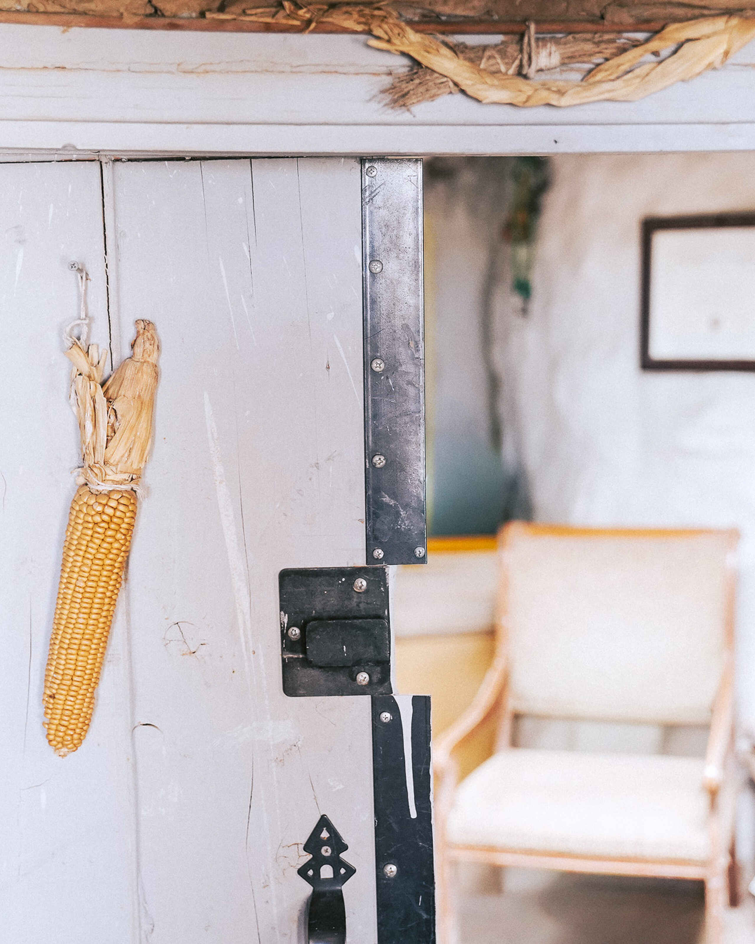 Dried corn cob hanging in a doorway of a traditional Hopi home